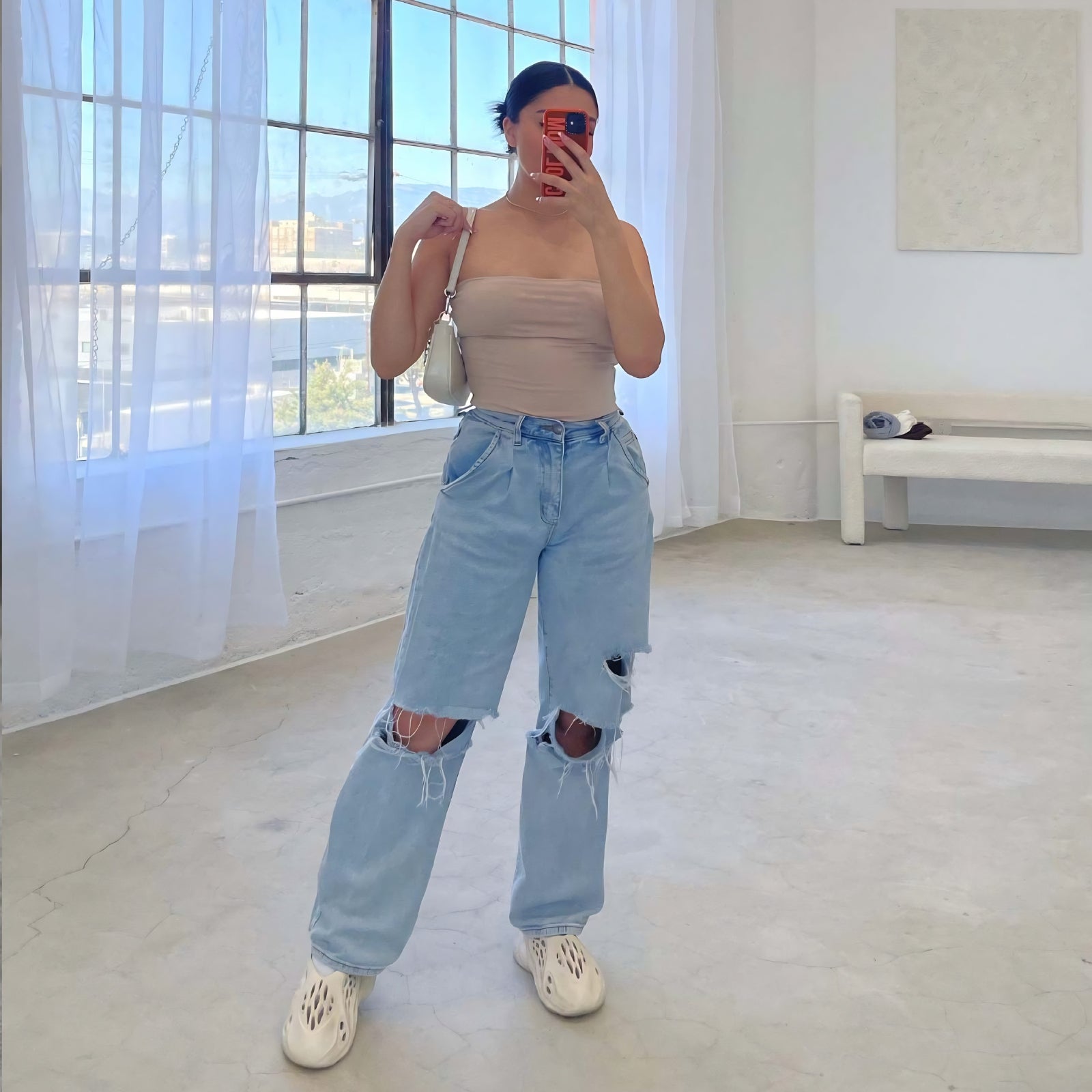 Zoe Harrington | Ripped mom jeans in light blue denim for women