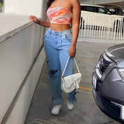 Zoe Harrington | Ripped mom jeans in light blue denim for women