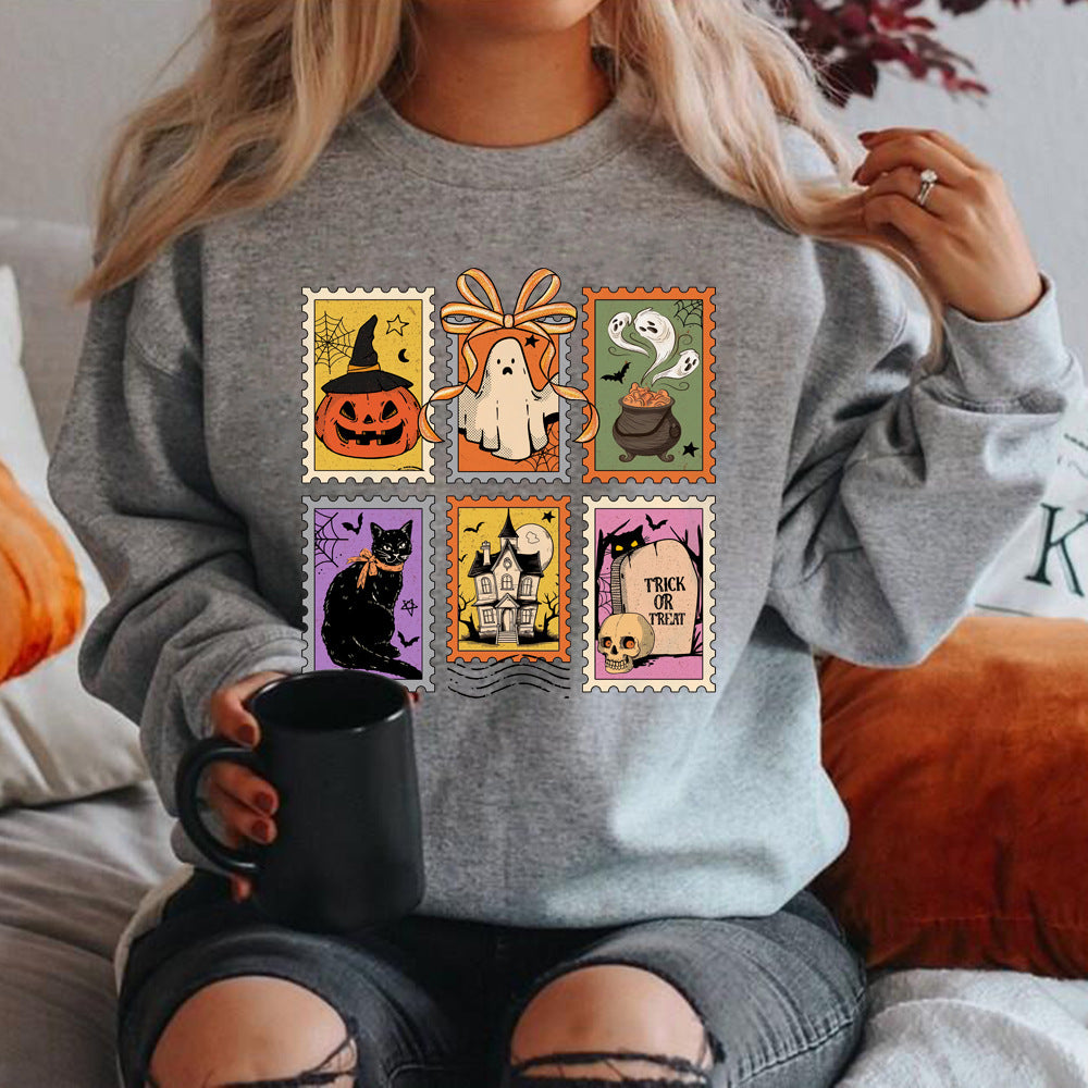 Halloweenský svetr Cauldron Cat | s koláží strašidelných razítek