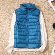 Signe Dahl | Lightweight blue down vest with a stand-up collar
