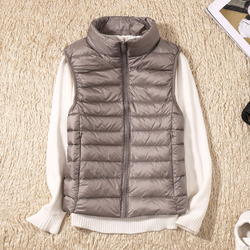 Signe Dahl | Lightweight blue down vest with a stand-up collar