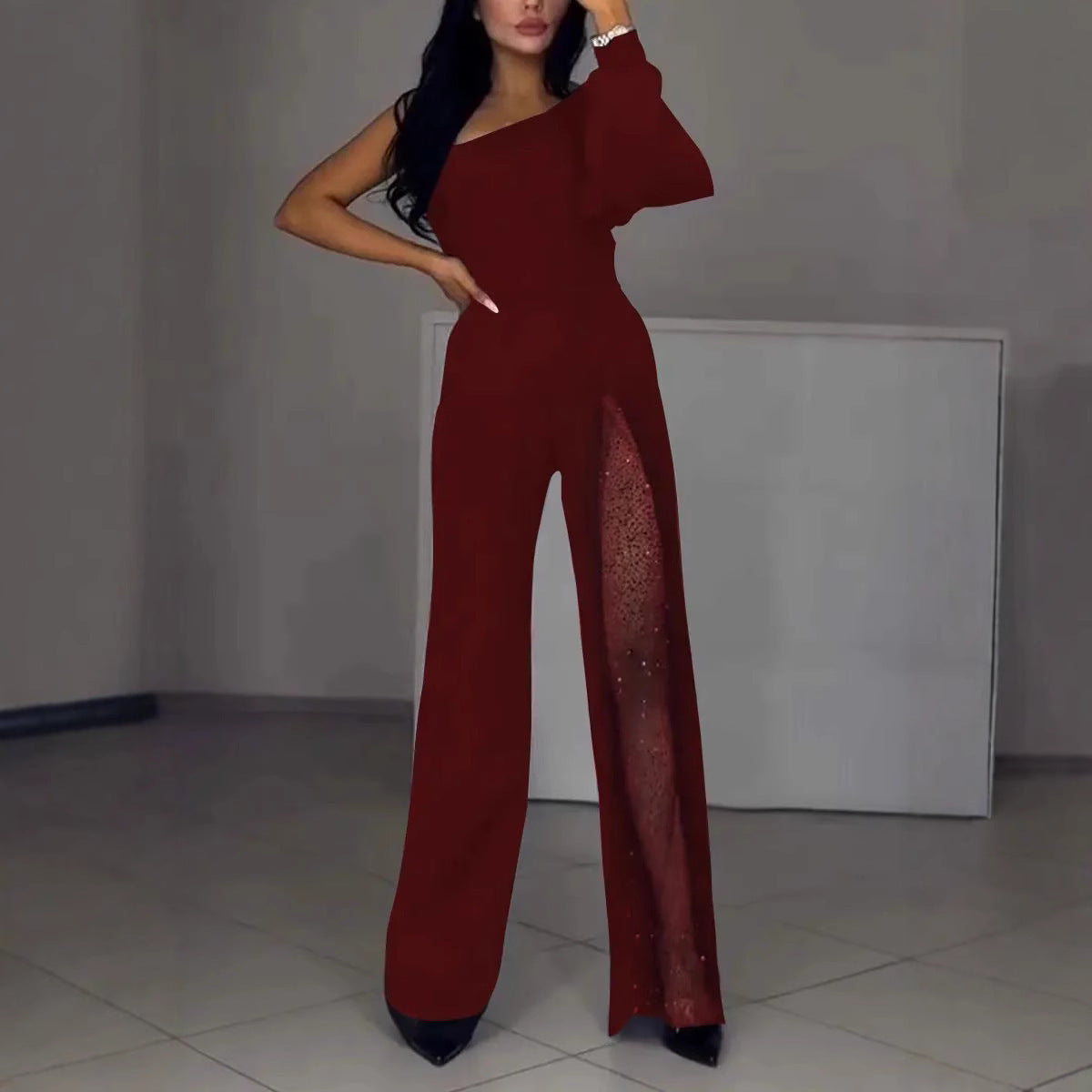 Serena Villanueva | Sort jumpsuit med mesh-pailletpanel og lange ærmer til kvinder
