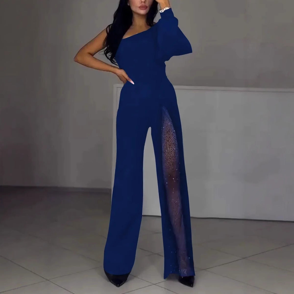 Serena Villanueva | Sort jumpsuit med mesh-pailletpanel og lange ærmer til kvinder