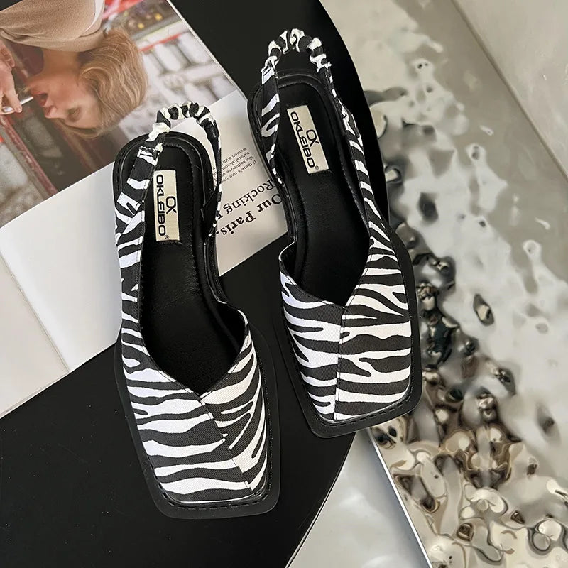Celeste Whitmore | Slingback sandaler med minimalistisk elegance