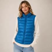 Signe Dahl | Lightweight blue down vest with a stand-up collar