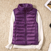 Signe Dahl | Lightweight blue down vest with a stand-up collar