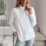 Geneviève Laurent | Elegant flæsebluse med knapdetaljer til kvinder